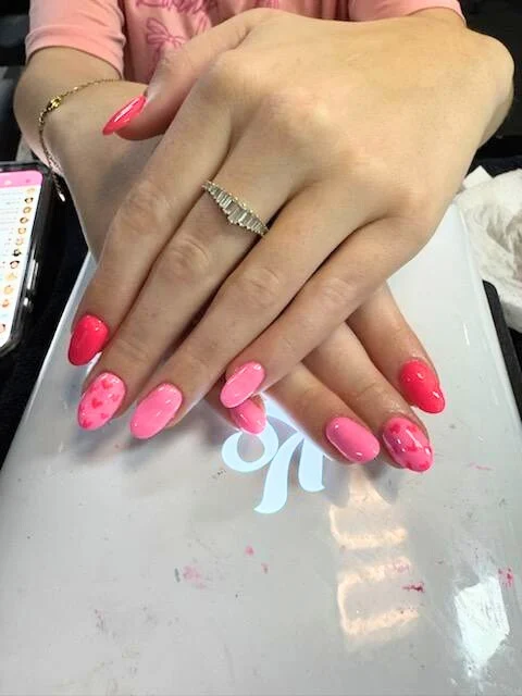 Manicured hands showing off fresh nail polish.